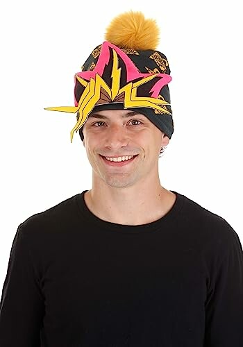 Man wearing a colorful Yu-Gi-Oh themed hat with a pom-pom.