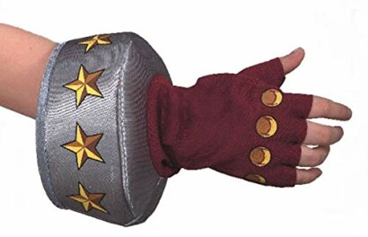 Child's hand wearing a superhero costume glove with gold stars and red fingerless gloves.